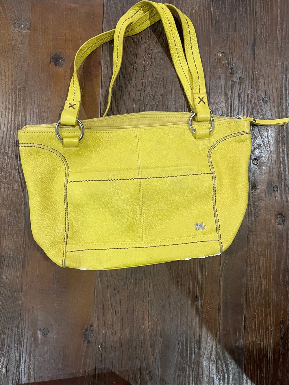 Yellow Leather purse byThe Sak in yellow dandelion colour